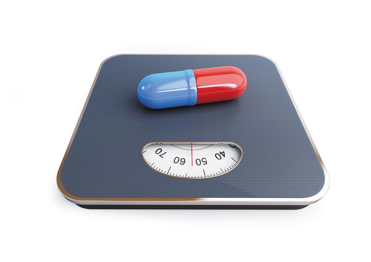 photo of a red and blue pill capsule on a bathroom scale